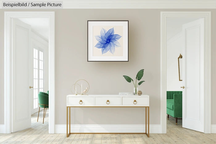 Modern white console table with decor and framed blue abstract flower artwork on a beige wall, flanked by open doorways.