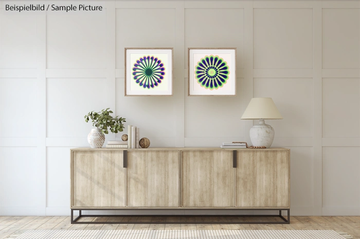 Modern living room with wooden sideboard, two abstract flower prints, and decorative lamp and vases.