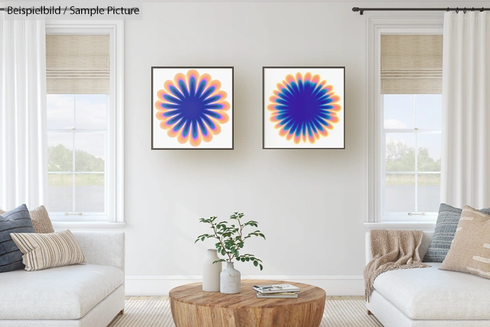 Modern living room with two abstract art pieces, patterned cushions, a wooden coffee table, and potted plant.