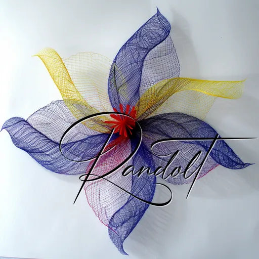 Colorful abstract floral sculpture with layered mesh petals in purple, yellow, and red hues, signed 'Randolt'.