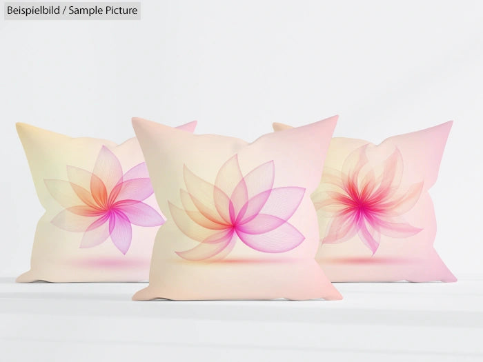 Three decorative pillows with pastel floral designs on a white background.