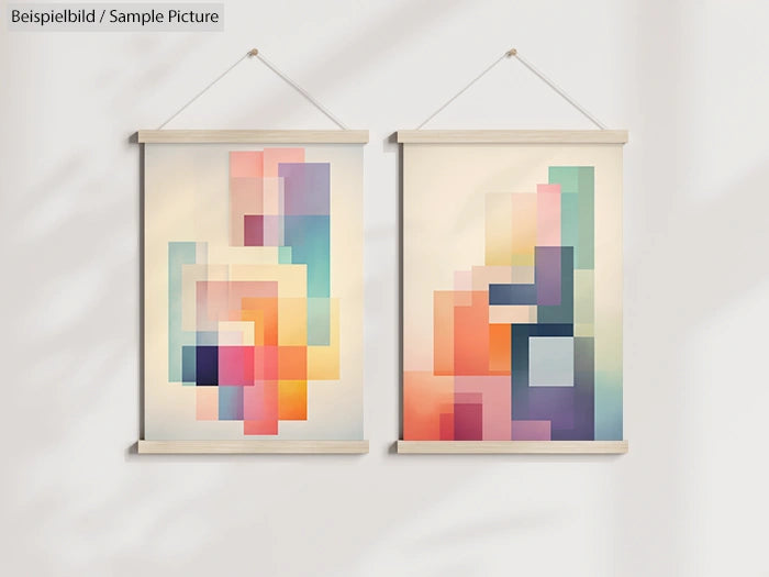Two abstract geometric paintings with colorful squares and rectangles, hung on a light wall.