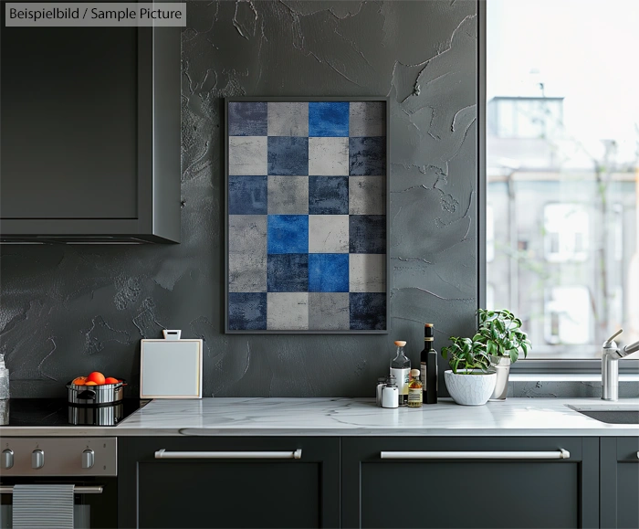 Modern kitchen with a checkered blue and gray wall art above white marble countertop, accented by a plant and spices.