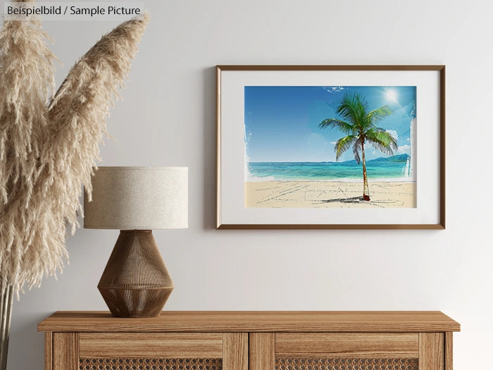 Framed beach painting with palm tree on a wall above a wooden cabinet and a lamp with pampas grass.