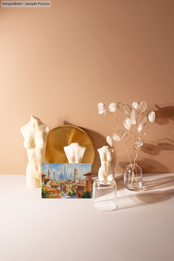 Artistic display with abstract sculpture, fragile plants, and colorful cityscape painting on a minimalist beige background.