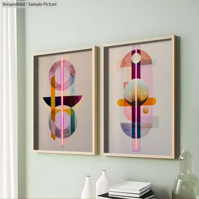 Two framed abstract geometric paintings with colorful circles and lines on a light green wall, beside decorative items.