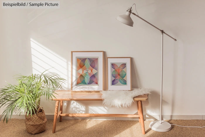 Minimalist interior with abstract paintings, a potted plant, and floor lamp on textured rug.