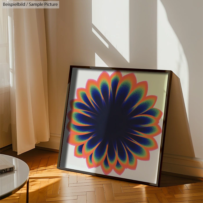 Framed abstract art piece with a floral pattern in vibrant colors, leaning against a wall on wooden flooring.