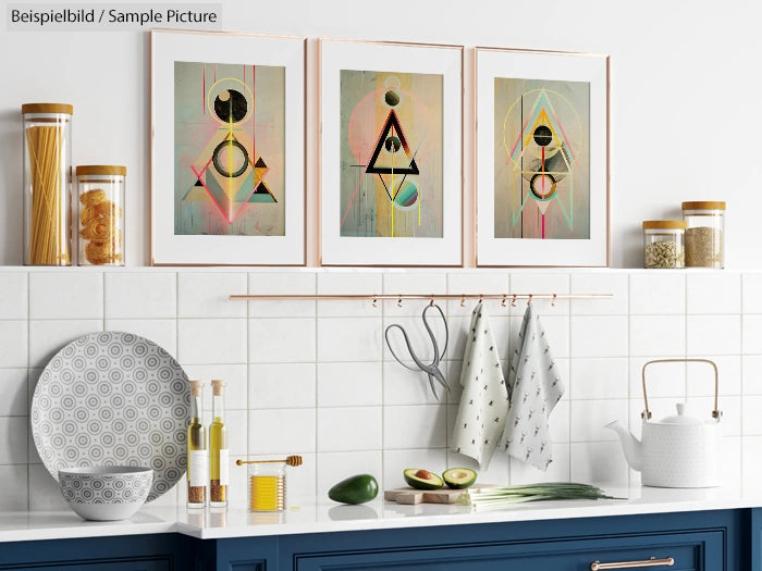 Modern kitchen with blue cabinets, white backsplash, abstract art, and decorative items on shelves.