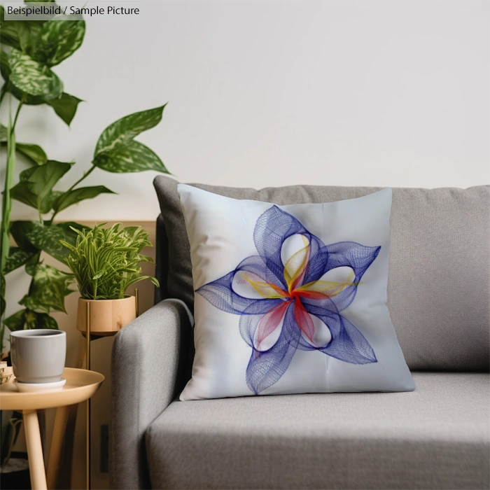 Modern living room with a gray sofa, decorative pillow with abstract floral print, and potted plants in background.