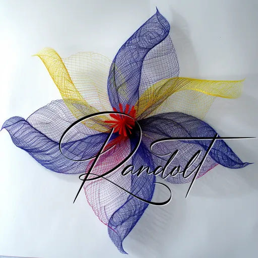 Colorful abstract floral sculpture with layered mesh petals in purple, yellow, and red hues, signed 'Randolt'.