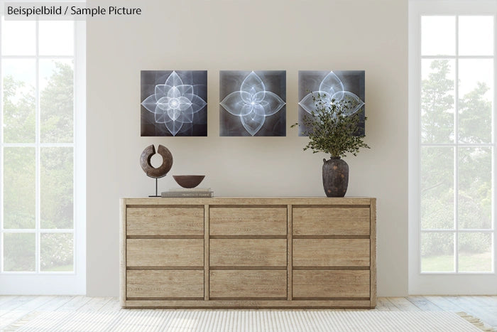 Minimalist room with wooden dresser, decorative vases, and abstract floral artworks on wall.