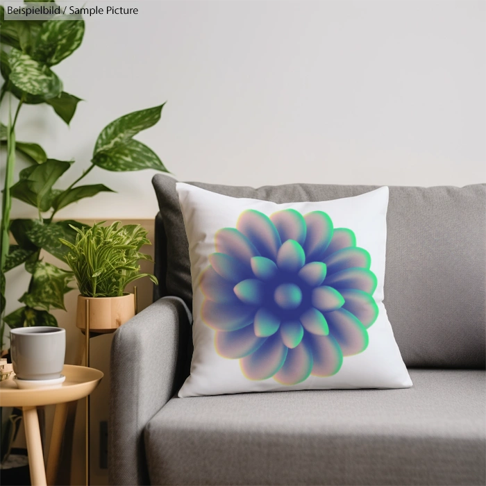 Couch with a white pillow featuring a colorful flower pattern, beside green plants and a coffee cup on a side table.